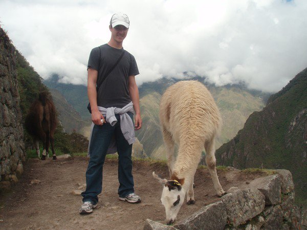 Explorica student traveler with wildlife at Machu Picchu