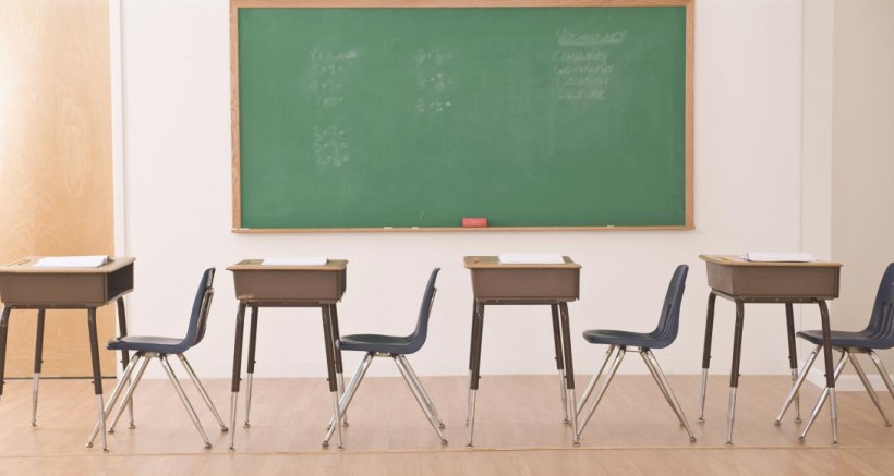 desks in row in classroom